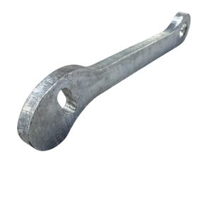 Metal ring-spanner wrench with a round head containing a hole and a long handle used to turn fasteners.